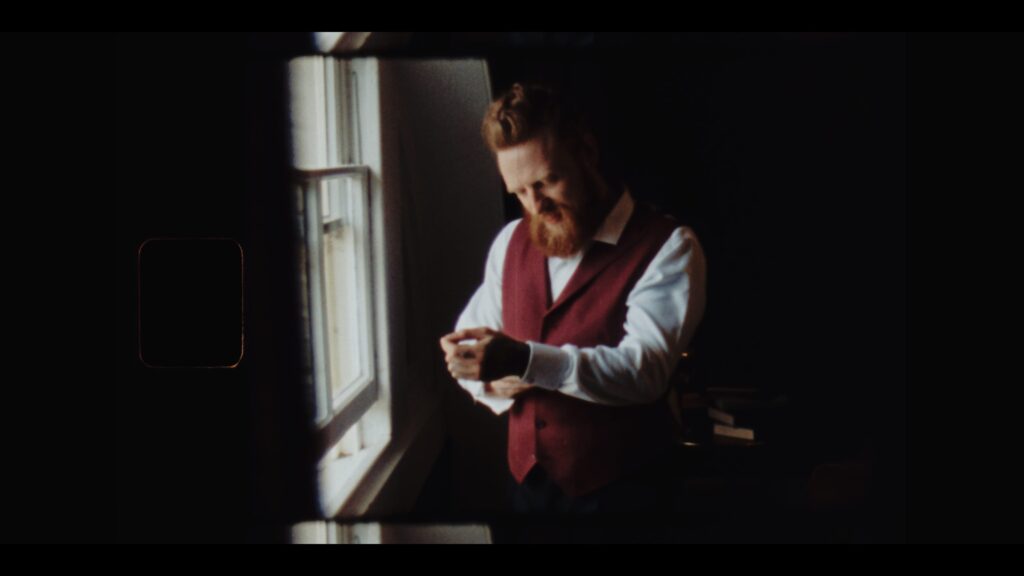 A groom getting ready at Prestwold Hall shot on authentic Super 8 film