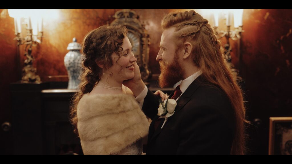 A wedding couple in the hall way at Prestwold Hall for some stunning couple footage